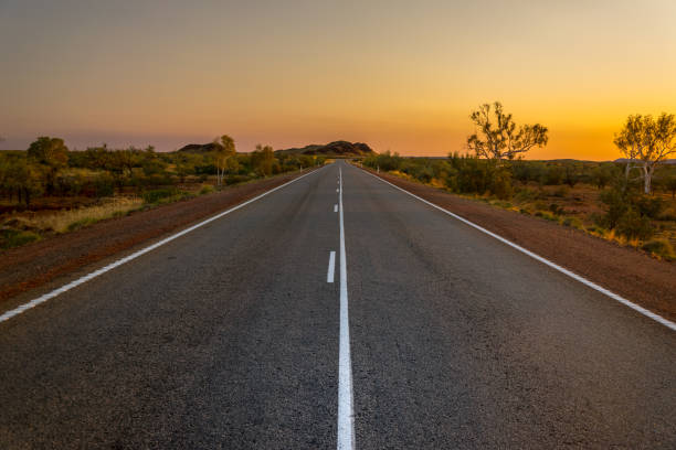 Sunset over australian highway stock photo