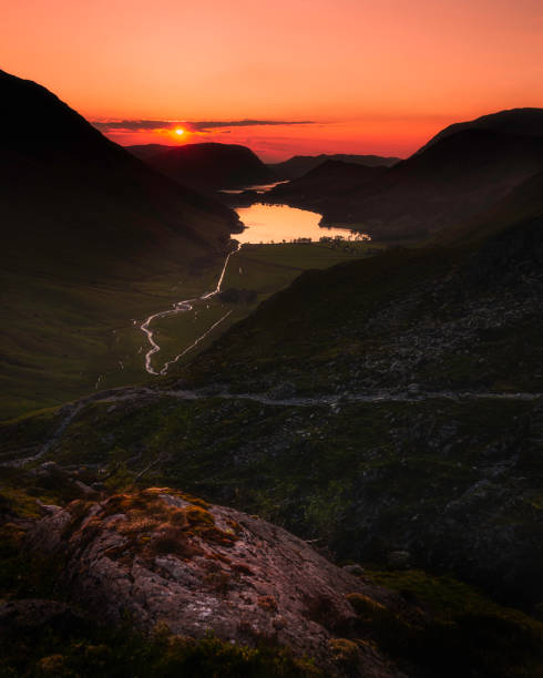 Sunset over Buttermere lake in Lake District, Cumbria, UK. stock photo