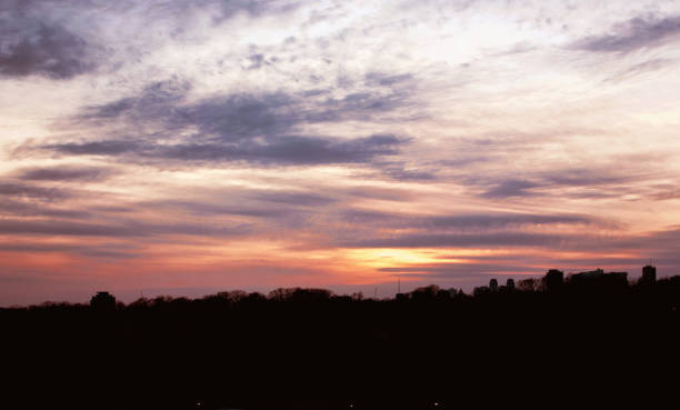 Sunset over Darkened Landscape stock photo