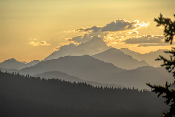 Sunset over forested ridges south west of Manning Park, BC stock photo