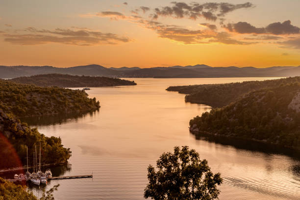 Sunset over Krka River and Lake Prokljan in Croatia stock photo