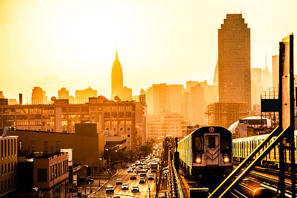 Sunset over New York skyline Sunset over New York skyline, on the subway overground train station brooklyn new york stock pictures, royalty-free photos & images