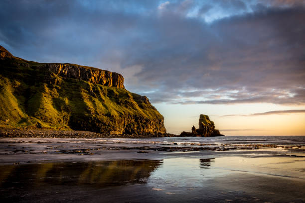 Sunset over the beach at Talisker Bay, Isle of Skye, Scotland stock photo