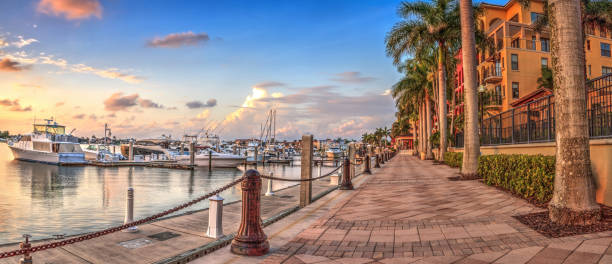 Sunset over the boats in Esplanade Harbor Marina in Marco Island stock photo