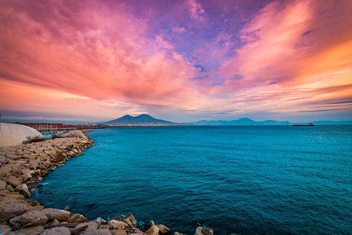 Purple sky over the bay in Naples, Mount Vesuvius in the distance