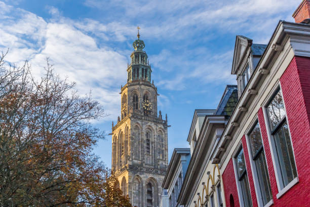 Sunset over the Martini church tower in Groningen Sunset over the Martini church tower in Groningen, The Netherlands groningen city stock pictures, royalty-free photos & images