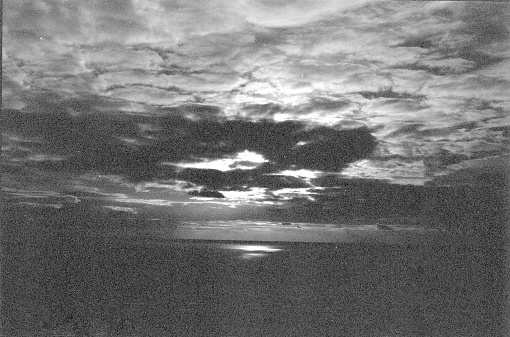 A setting sun over cal waters in Devon, 35mm film.