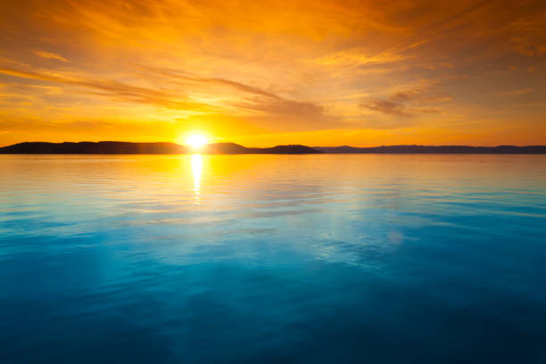 Photo of Sunset over water