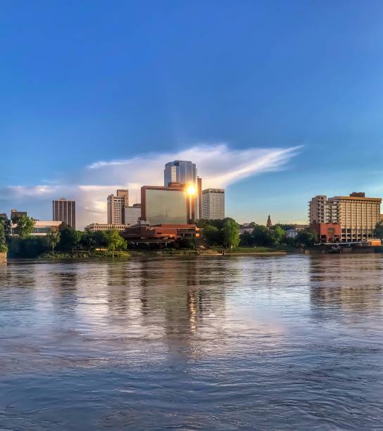 Sunset Reflecting Off the Little Rock Skyline The setting sun is reflected in the skyscrapers along the Arkansas River michael dean shelton stock pictures, royalty-free photos & images