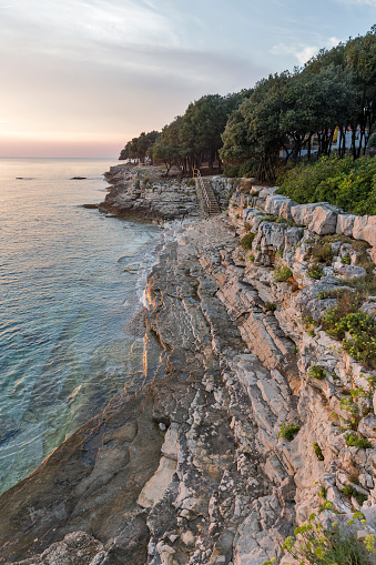 Sunset rocky beach in Istria, Croatia. Solaris summer resort, Adriatic Sea, Lanterna peninsula. HDR