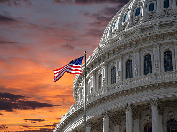 Sunset Sky over US Capitol Building Sunset sky over the US Capitol building dome in Washington DC. architectural dome stock pictures, royalty-free photos & images