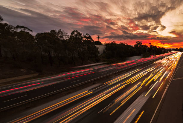 Sunset traffic on freeway stock photo
