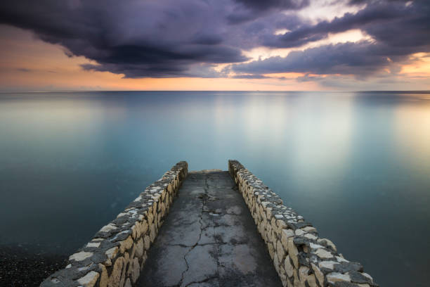 Sunset view from a stone pier stock photo