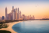 istock Sunset view of the Dubai Marina and JBR area and the famous Ferris Wheel and golden sand beaches in the Persian Gulf. Holidays and vacations in the UAE 1333035210