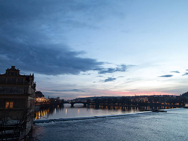 Sunset View of the River Vltava in Prague Sunset View of the River Vltava in Prague vltava river stock pictures, royalty-free photos & images