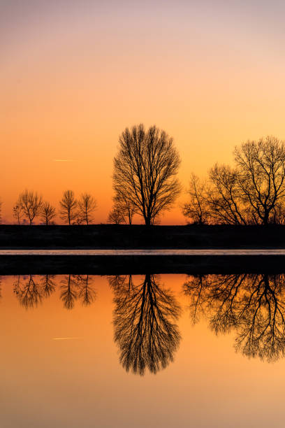 Sunset water reflection stock photo