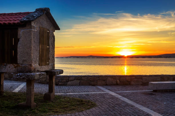 Sunset with traditional barn in Galicia stock photo