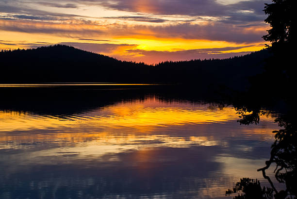 Sunset on Cascade Lake Sunsets in the San Juan Islands can be spectacular. This sunset was photographed from Cascade Lake. Cascade Lake is in Moran State Park on Orcas Island, Washington State, USA. jeff goulden san juan islands stock pictures, royalty-free photos & images