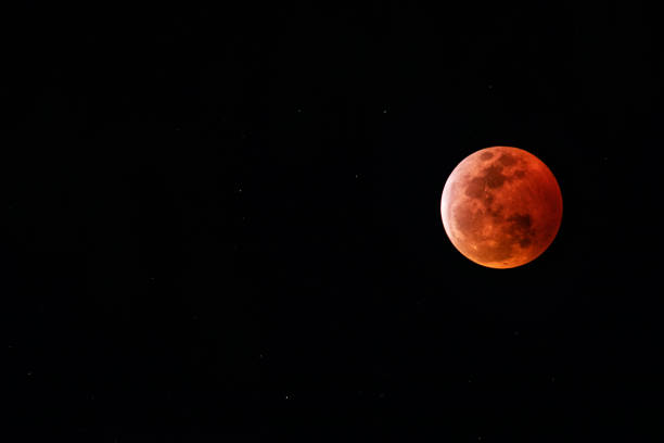 Super blood moon 2019 Kapaa, HI, - January 20, 2019: Super blood moon from the island of Kaua"u2019i Hawaii. The super blood moon is a nickname for when there is a total lunar eclipse which coincides with the moon at perigee. blood moon stock pictures, royalty-free photos & images