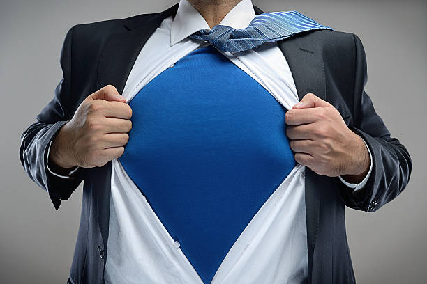 Super businessman Superhero businessman pulls open shirt. Change and success concept. heroes stock pictures, royalty-free photos & images