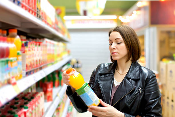 supermarket buying a bottle of juice stock photo