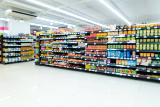 Supermarket goods shelf on blurred. stock photo