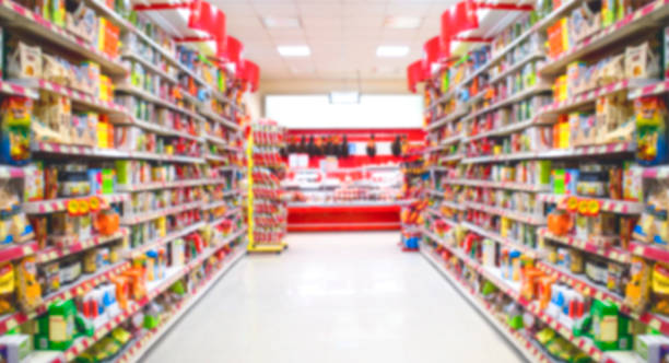 Supermarket in blurry for background Supermarket in blurry for background chain store stock pictures, royalty-free photos & images