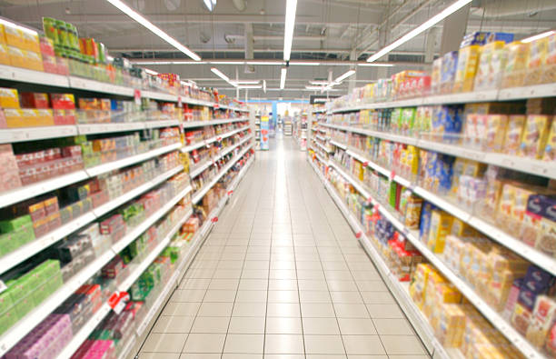supermarket perspective Wide perspective of empty supermarket aisle aisle stock pictures, royalty-free photos & images