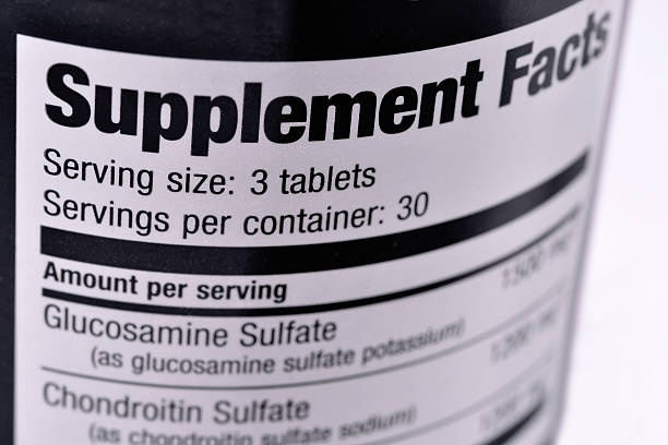 Supplement Facts Closeup of a bottle of nutritional supplements glucosamine stock pictures, royalty-free photos & images