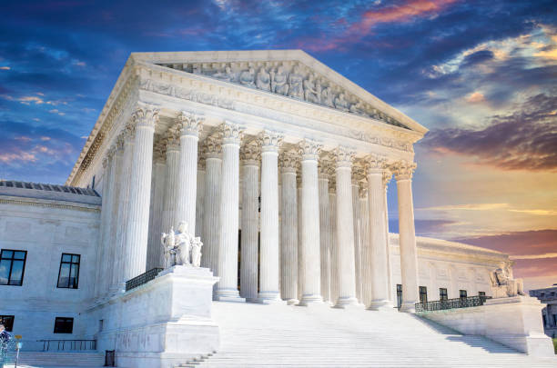 Supreme Court in Washington DC at Sunset United States Supreme Court Building in Washington DC. supreme court stock pictures, royalty-free photos & images