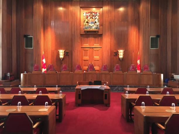 Supreme Court of Canada Chamber The chamber of the Supreme Court of Canada with the Canadian Coat of Arms courtroom stock pictures, royalty-free photos & images