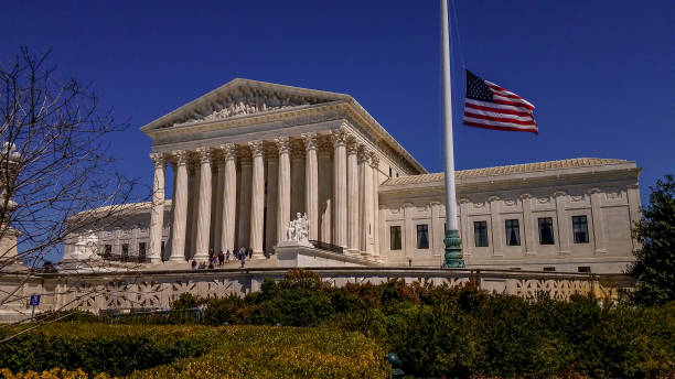 Supreme Court of the United States and American Flag in Washington, DC stock photo