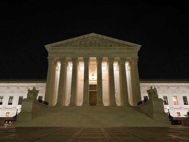Supreme Court of the United States SCOTUS at night supreme court building stock pictures, royalty-free photos & images