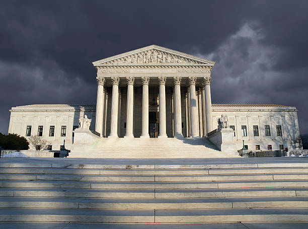 Supreme Court Storm Dark forbidding troubled storm sky over the United States Supreme Court building in Washington DC. supreme court stock pictures, royalty-free photos & images