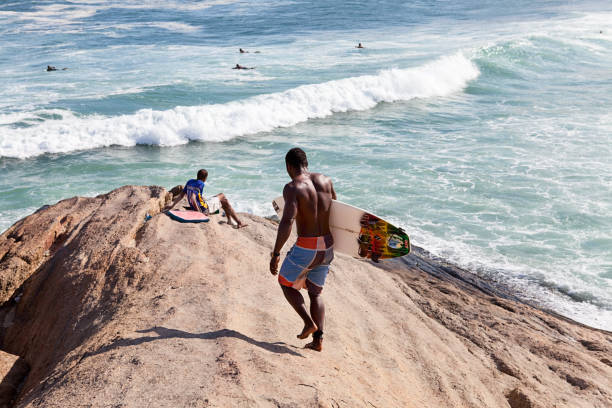 Surfers on Ipanema Beach, Rio de Janeiro, Brazil stock photo