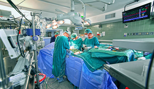 Surgeons in operating room stock photo