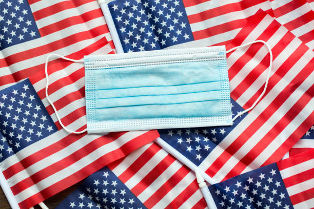 Surgical masks and American Flags stock photo