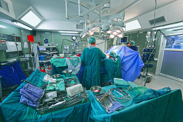 Surgical team operating a patient stock photo