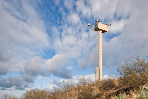 Surveillance Tower on the USA - Mexico Border A surveillance tower guards the USA-Mexico Border between Nogales, Arizona, USA and Nogales, Sonora, Mexico. jeff goulden border security stock pictures, royalty-free photos & images