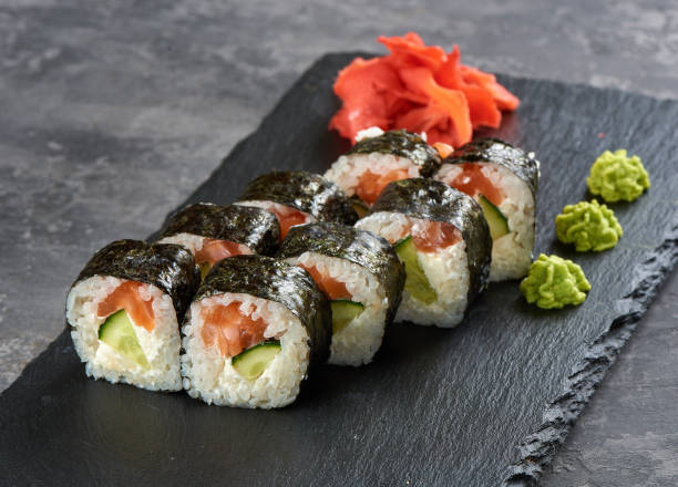 Sushi rolls with salmon and cucumber stock photo