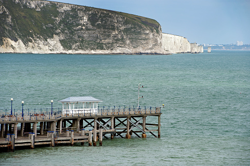 Swanage Pier and Old Harry Rocks from the Isle of Purbeck along the Jurassic Coast in Dorset, England