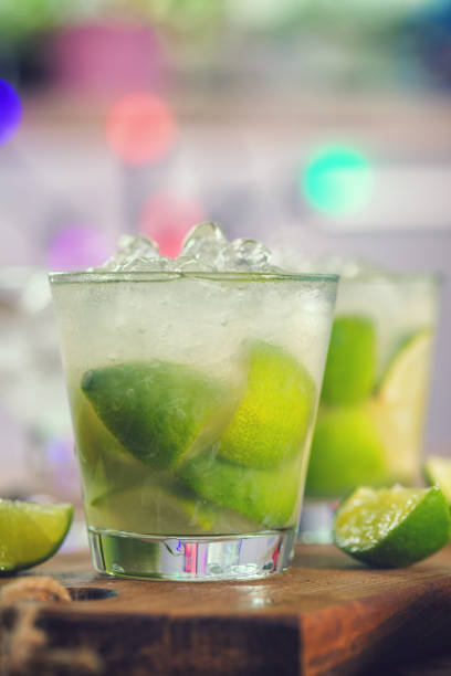 Sweet and Refreshing Drink Caipirinha Cocktail Sweet and refreshing Caipirinha national cocktail from Brazil made with lime,ice, sugar, and a sugarcane liquor vodka soda stock pictures, royalty-free photos & images
