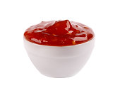 Sweet chili pepper sauce in bowl, isolated on white background. Spicy tomato and chili pepper sauce