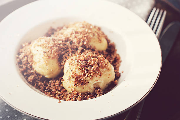 Sweet cottage cheese dumplings with breadcrumbs stock photo