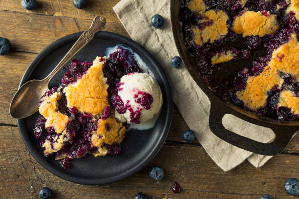 Sweet Homemade Blueberry Cobbler Dessert Sweet Homemade Blueberry Cobbler Dessert with Ice Cream crumble stock pictures, royalty-free photos & images