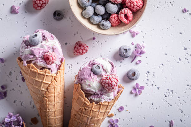 Sweet ice cream with blueberries. Flower flavour ice cream stock photo
