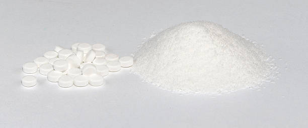 Sweetener One pile of sweetener tablets and one pile of sweetener powder. amphetamine stock pictures, royalty-free photos & images