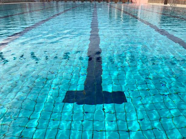 Swimming pool background - starting block and racing lane without people. Swimming pool background - starting block and racing lane without people. asien startblock stock pictures, royalty-free photos & images