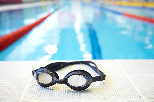 Swimming pool Image of swimming pool and goggles. Nobody swimming goggles stock pictures, royalty-free photos & images