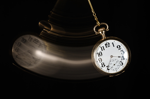 Swinging Pocket Watch Beckoning You to Look More Closely